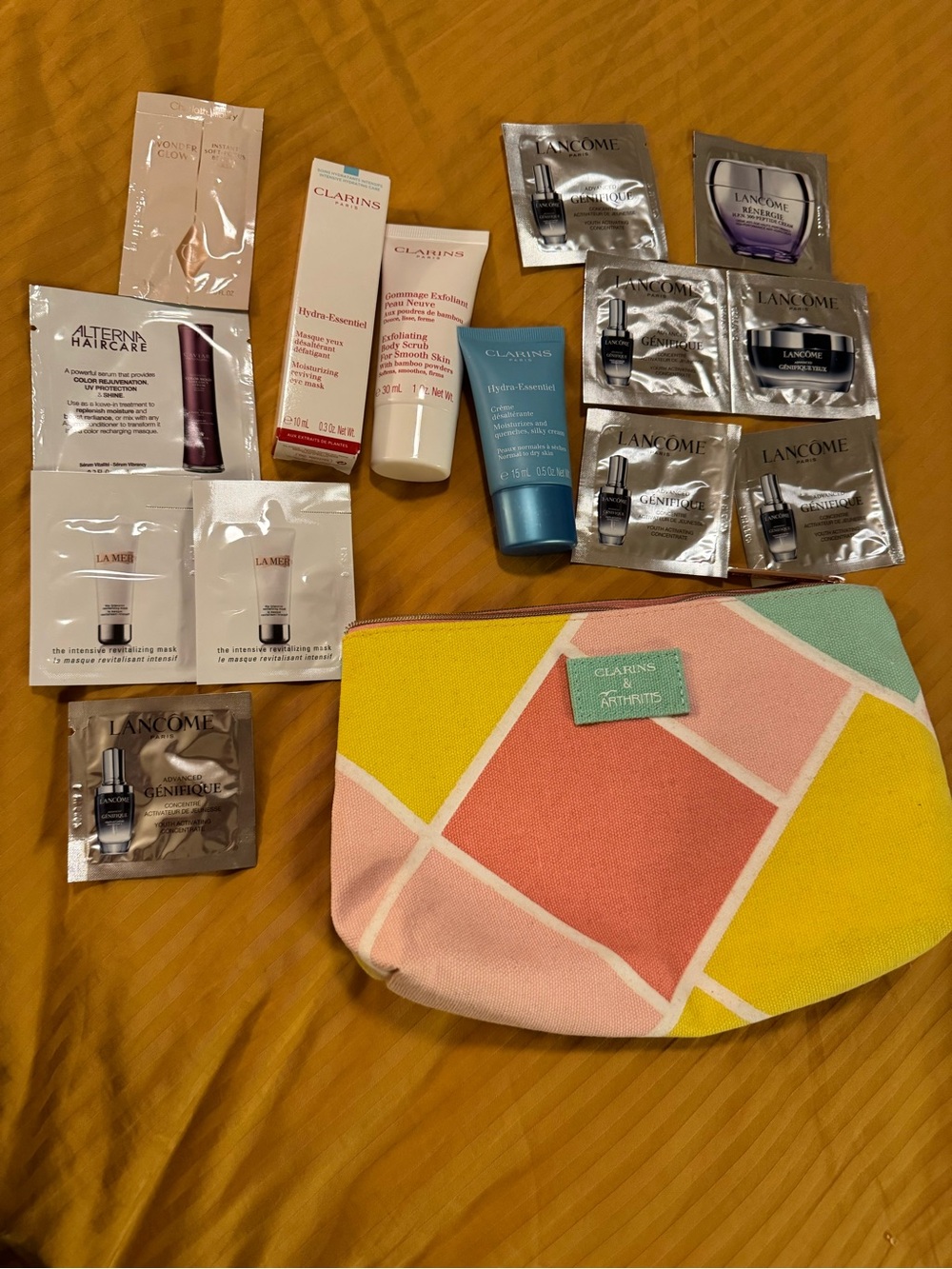 Clarins Pouch with Clarins and other product samples